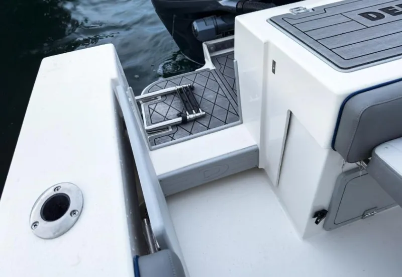 Slide: The Image of 2025 Defiance Admiral 260 EX boat deck with ladder and seating. - 17