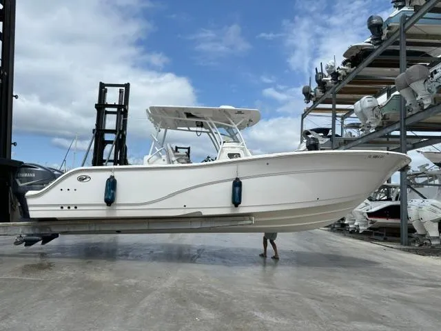 Slide: The Image of 2020 Sea Fox Commander 328 boat in dry dock, clear sky background. - 1