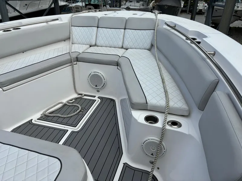 Slide: The Image of 2020 Sea Fox Commander 328 boat interior with cushioned seating and marine speakers. - 13