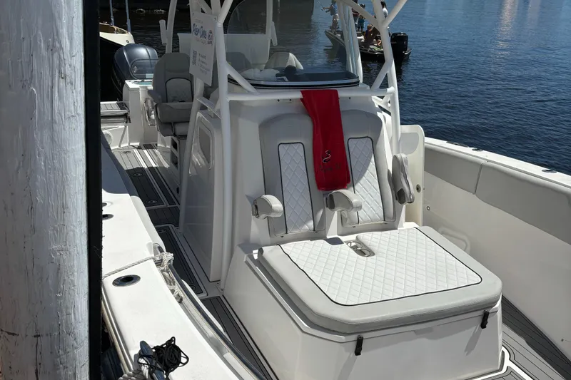 Slide: The Image of 2020 Sea Fox Commander 328 boat docked, featuring comfortable seating and sleek design. - 5