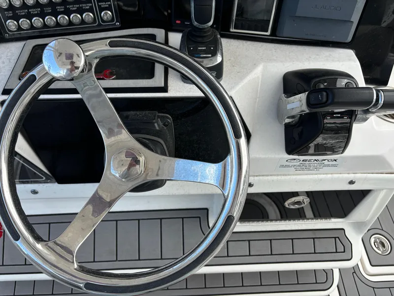 Slide: The Image of Steering wheel and controls of a 2020 Sea Fox Commander 328 boat. - 8
