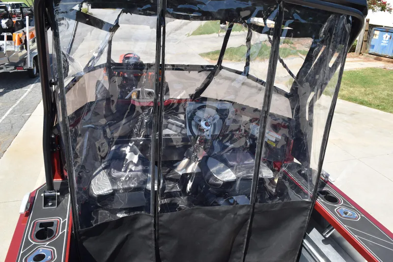 Slide: The Image of 2025 Stabicraft 1550 Fisher Profish boat with protective canopy and modern interior. - 10