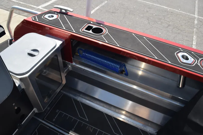 Slide: The Image of 2025 Stabicraft 1550 Fisher Profish boat interior with storage and fishing rod holder. - 11