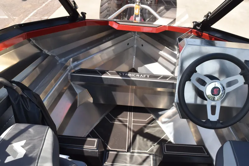 Slide: The Image of 2025 Stabicraft 1550 Fisher Profish boat interior with steering wheel and seating. - 17