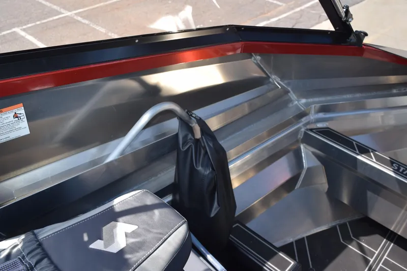 Slide: The Image of Interior of 2025 Stabicraft 1550 Fisher Profish boat, featuring sleek aluminum design. - 18