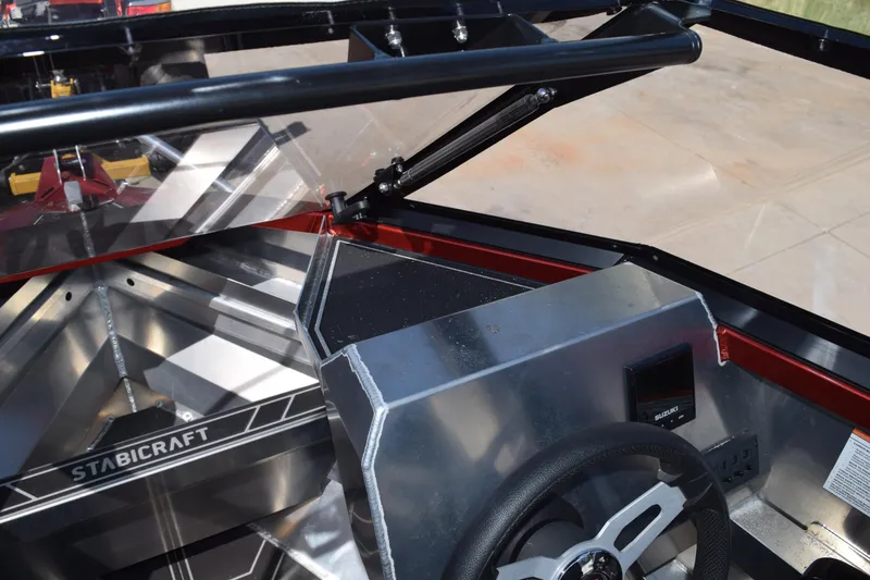 Slide: The Image of 2025 Stabicraft 1550 Fisher Profish boat interior with steering wheel and dashboard. - 27