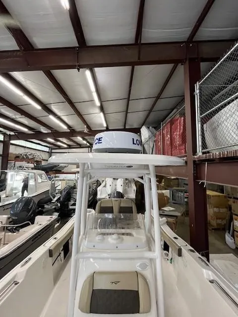 Slide: The Image of 2021 Tidewater 220 CC Adventure boat in storage facility. - 11