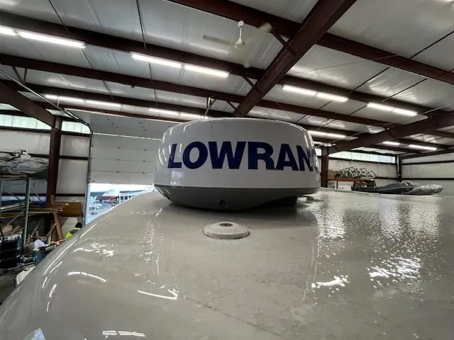 Slide: The Image of Lowrance radar on 2021 Tidewater 220 CC Adventure boat in a warehouse. - 12