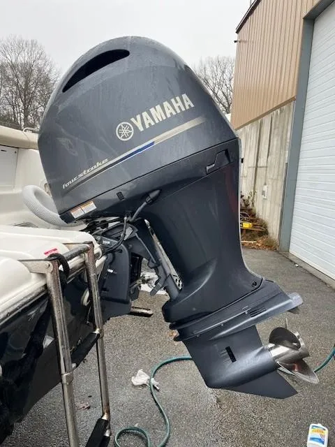 Slide: The Image of 2021 Tidewater 220 CC Adventure with Yamaha outboard motor in a boatyard. - 14
