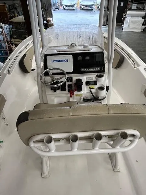Slide: The Image of 2021 Tidewater 220 CC Adventure boat console with Lowrance electronics and rod holders. - 21