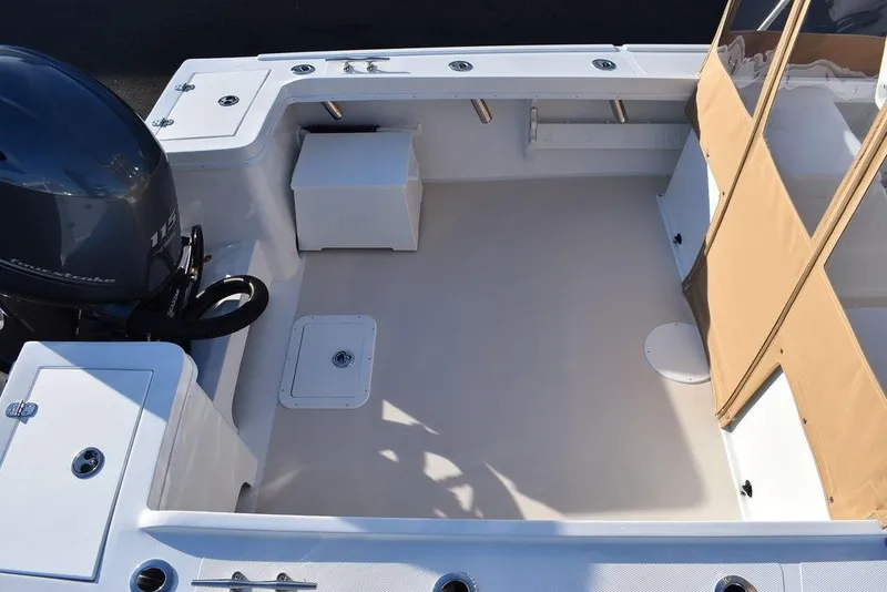 Slide: The Image of 2025 Steiger Craft 21 Peconic boat interior with outboard motor and seating area. - 13