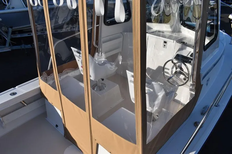 Slide: The Image of 2025 Steiger Craft 21 Peconic boat with enclosed helm and seating area. - 14