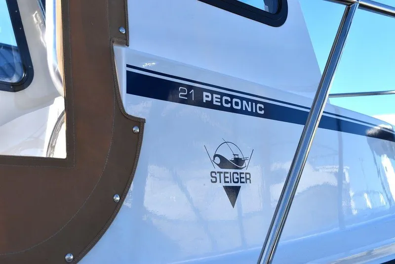 Slide: The Image of 2025 Steiger Craft 21 Peconic boat side view with logo and model name. - 16