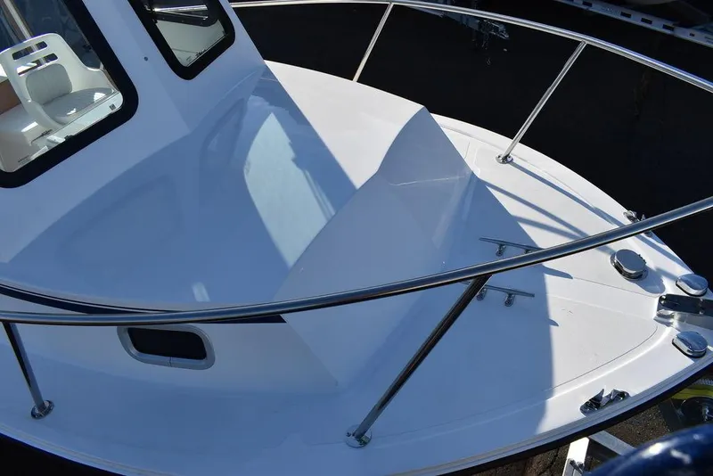 Slide: The Image of 2025 Steiger Craft 21 Peconic boat deck with railing and cabin view. - 18