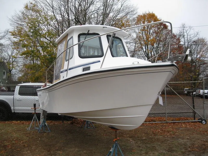 Slide: The Image of 2025 Steiger Craft 21 Peconic boat on stands, autumn background. - 2