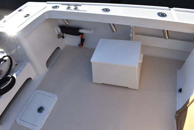 Slide: The Image of 2025 Steiger Craft 21 Peconic boat interior with seating and storage. - 20