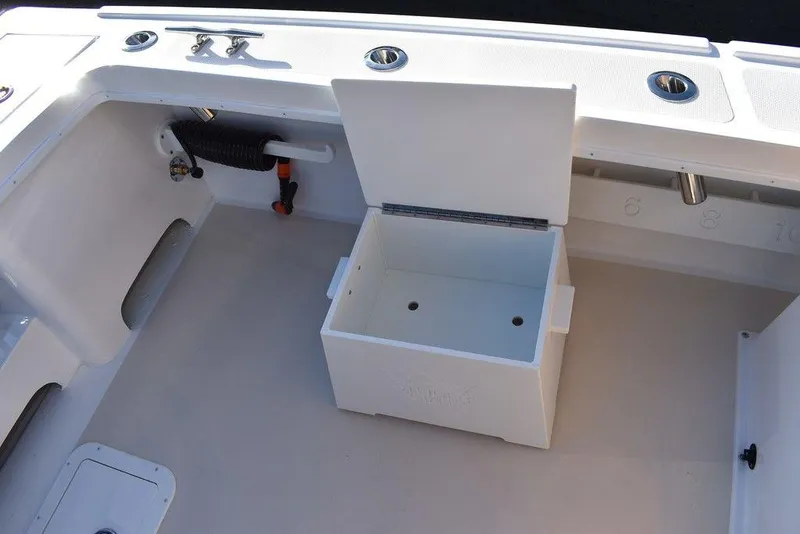 Slide: The Image of 2025 Steiger Craft 21 Peconic boat interior with open storage compartment. - 21