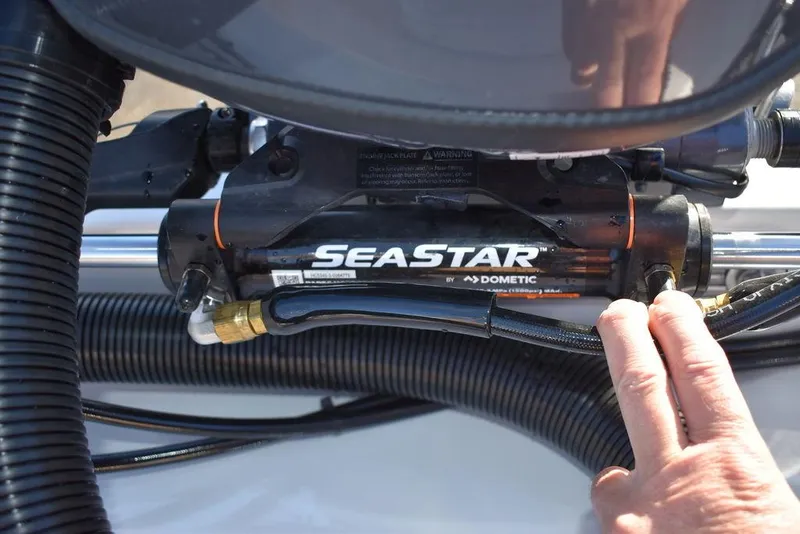 Slide: The Image of Close-up of SeaStar hydraulic steering system on 2025 Steiger Craft 21 Peconic boat. - 24