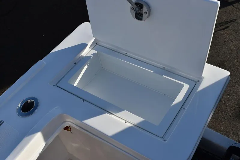 Slide: The Image of 2025 Steiger Craft 21 Peconic boat storage compartment, open lid, white interior. - 26