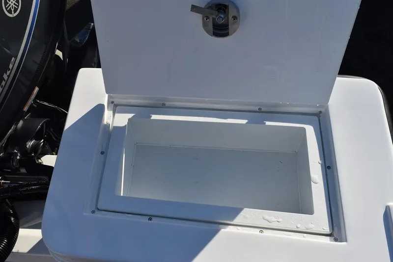 Slide: The Image of Steiger Craft 21 Peconic 2025 boat storage compartment with latch, open view. - 27