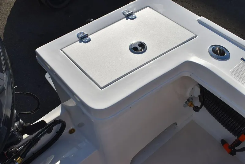 Slide: The Image of 2025 Steiger Craft 21 Peconic boat deck with storage compartment and cup holder. - 28