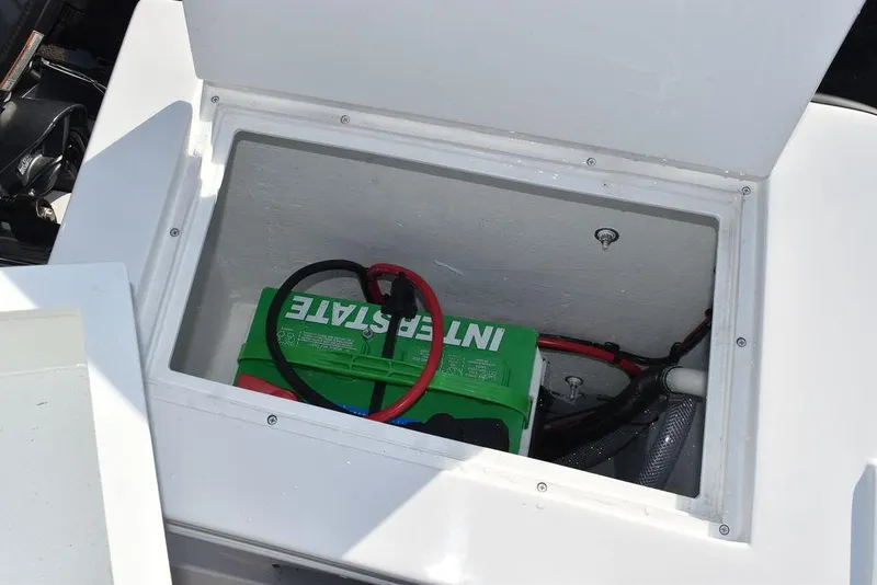 Slide: The Image of Battery compartment of 2025 Steiger Craft 21 Peconic boat, featuring Interstate battery. - 29