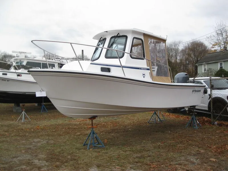 Slide: The Image of 2025 Steiger Craft 21 Peconic boat on stands, displayed outdoors. - 3