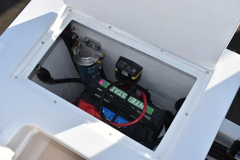 Slide: The Image of 2025 Steiger Craft 21 Peconic boat battery compartment with wiring and components. - 30