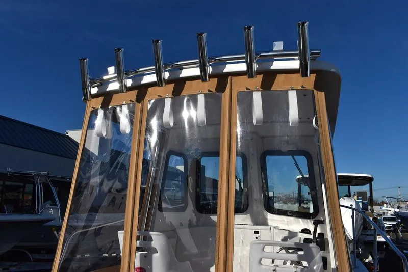 Slide: The Image of 2025 Steiger Craft 21 Peconic boat with rod holders and clear panels. - 32