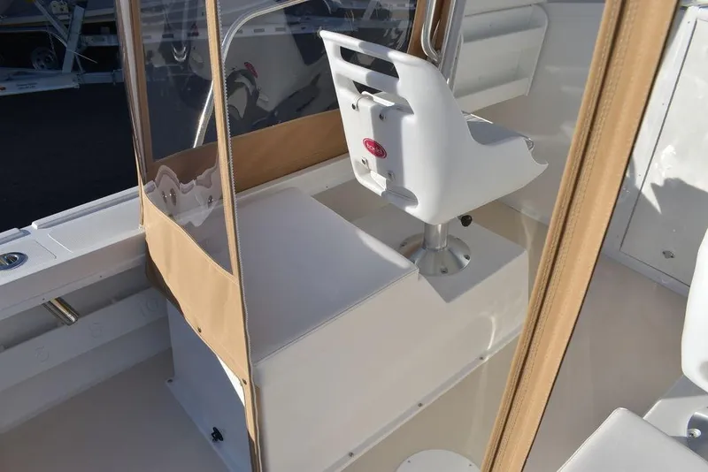 Slide: The Image of 2025 Steiger Craft 21 Peconic boat interior with helm seat and console. - 35