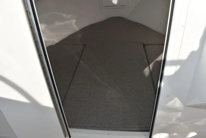 Slide: The Image of 2025 Steiger Craft 21 Peconic cabin interior with cushioned sleeping area. - 45