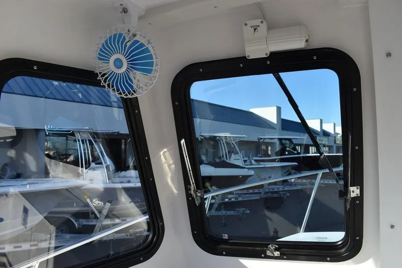 Slide: The Image of Interior view of 2025 Steiger Craft 21 Peconic boat with windows and fan. - 48