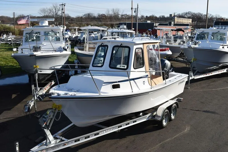 Slide: The Image of 2025 Steiger Craft 21 Peconic boat on trailer in a marina. - 6