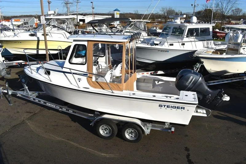 Slide: The Image of 2025 Steiger Craft 21 Peconic boat on trailer, parked in marina. - 7