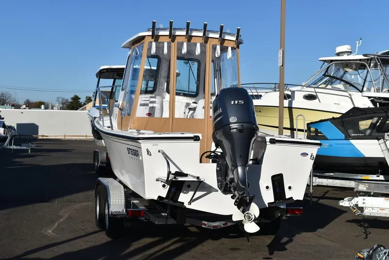 Slide: The Image of 2025 Steiger Craft 21 Peconic boat with outboard motor on trailer. - 9