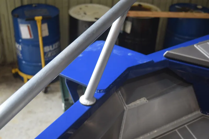 Slide: The Image of 2024 Stabicraft 1550 Frontier SportFish boat detail with blue and gray accents. - 18