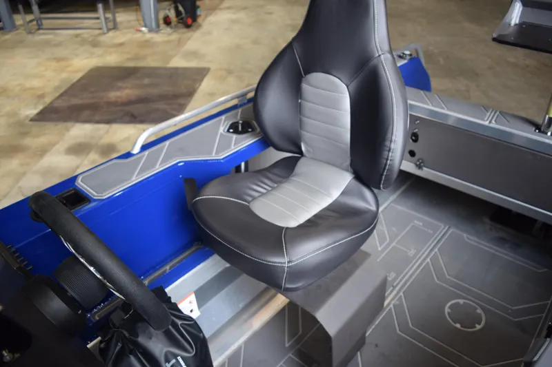 Slide: The Image of 2024 Stabicraft 1550 Frontier SportFish interior with black and gray seating. - 20