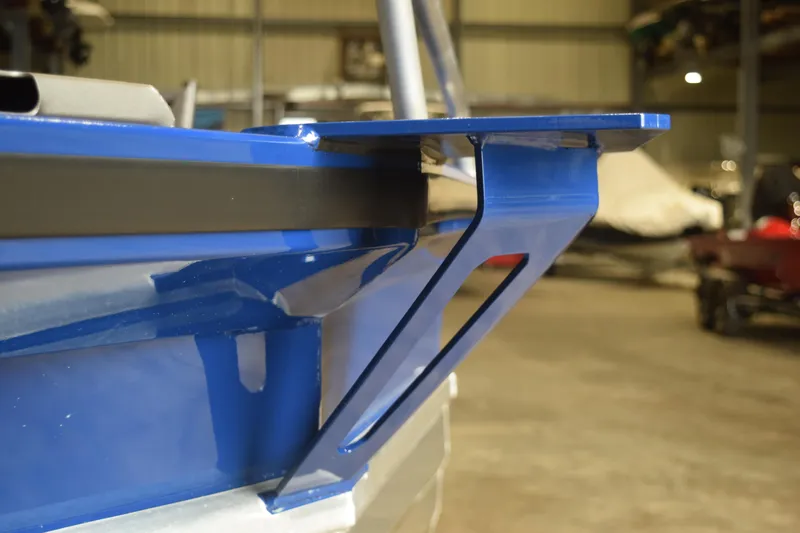 Slide: The Image of Close-up of 2024 Stabicraft 1550 Frontier SportFish boat detail in a warehouse. - 24