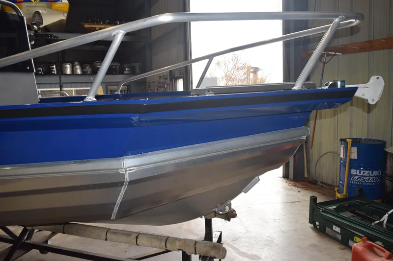 Slide: The Image of 2024 Stabicraft 1550 Frontier SportFish boat in a workshop setting. - 3