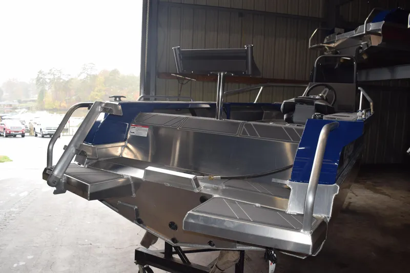 Slide: The Image of 2024 Stabicraft 1550 Frontier SportFish boat in a warehouse setting. - 5