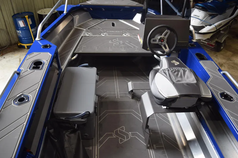 Slide: The Image of 2024 Stabicraft 1550 Frontier SportFish interior with steering wheel and seating. - 6