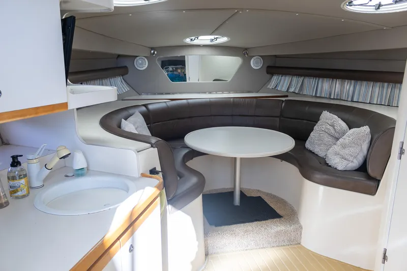 Slide: The Image of Interior of 1995 Cruisers Esprit 3570 yacht with cozy seating and table. - 25