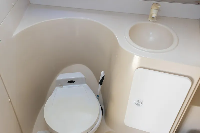 Slide: The Image of 1995 Cruisers Esprit 3570 boat bathroom with toilet and sink. - 33