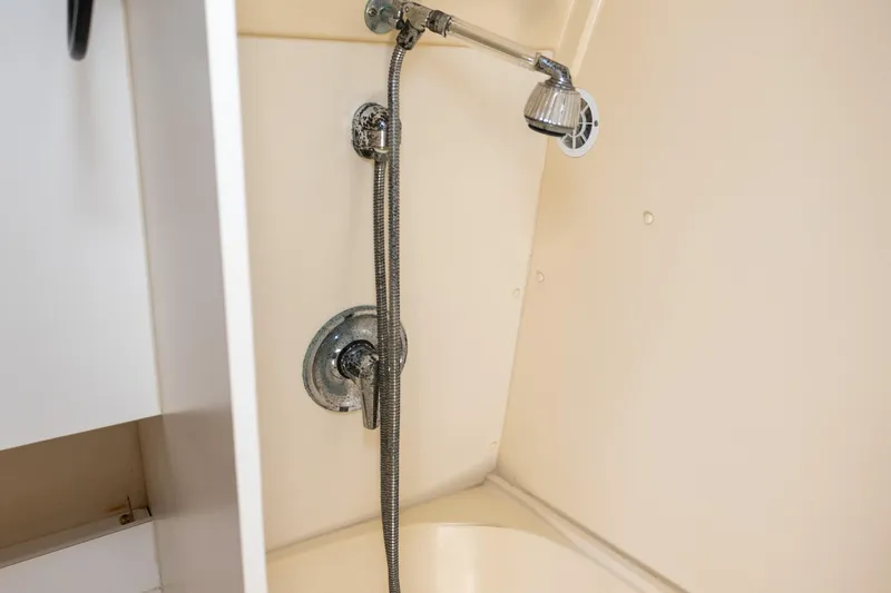 Slide: The Image of Shower area in 1995 Cruisers Esprit 3570 boat, featuring chrome fixtures. - 35