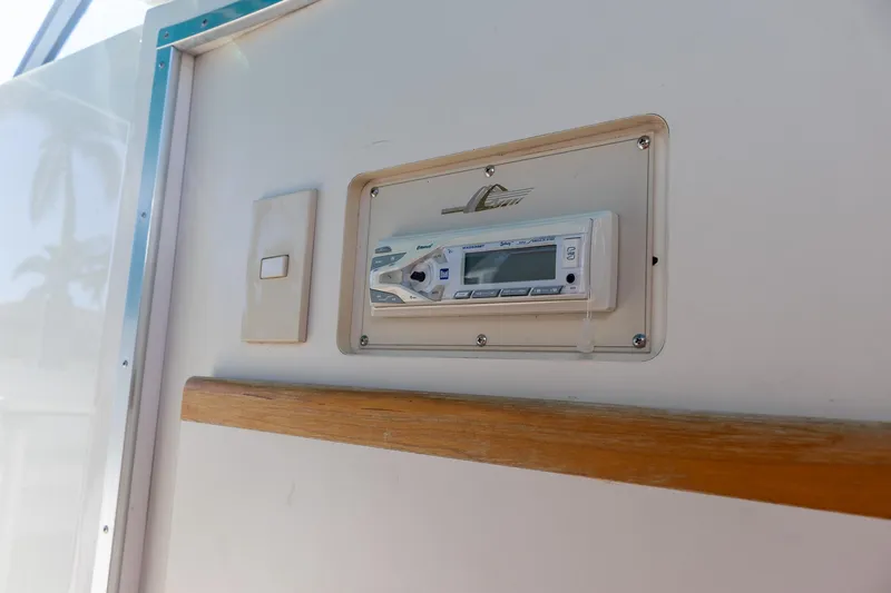 Slide: The Image of Control panel on 1995 Cruisers Esprit 3570 boat interior, featuring a digital display. - 39