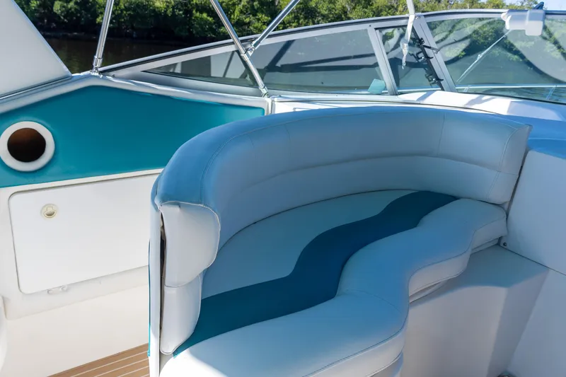 Slide: The Image of Interior of 1995 Cruisers Esprit 3570 boat with blue and white seating. - 8