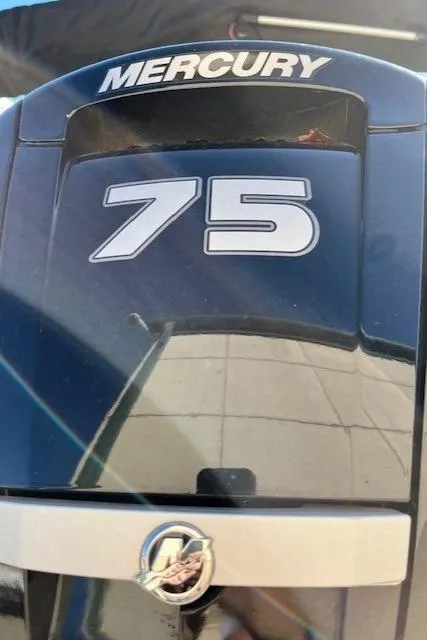 Slide: The Image of Mercury 75 horsepower engine on 2022 Sun Tracker Bass Buggy 18 DLX. - 2