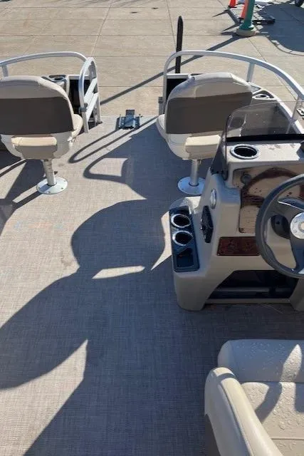 Slide: The Image of 2022 Sun Tracker Bass Buggy 18 DLX interior with seating and steering wheel. - 5