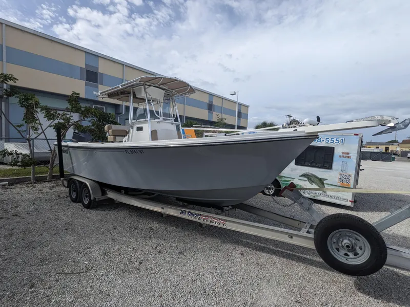 Slide: The Image of 2019 Parker 2500 SE Center Console boat on trailer, parked outdoors. - 0