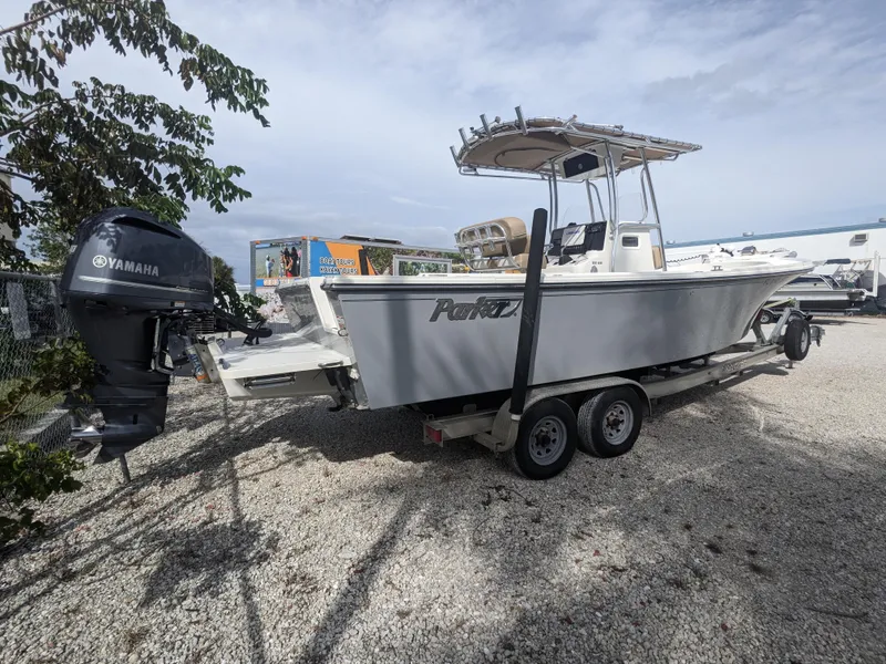 Slide: The Image of 2019 Parker 2500 SE Center Console boat on trailer with Yamaha outboard motor. - 1